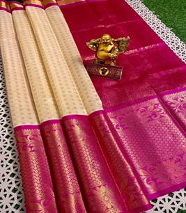 A red and white saree with a gold statue on it

Description automatically generated