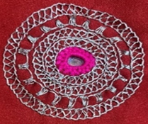 A close-up of a crochet doily

Description automatically generated