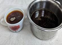 A bowl of brown liquid next to a bowl of brown liquid

Description automatically generated