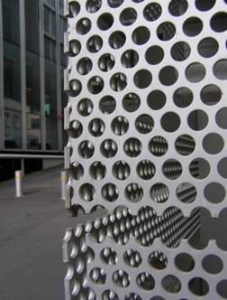 Close-up of a metal structure with holes

Description automatically generated with low confidence