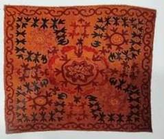 A close-up of an orange rug

Description automatically generated
